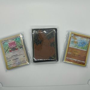 50 Pokémon Holo/Reverse Holo bundle 1 pack of mystery sleeves. All cards sleeved